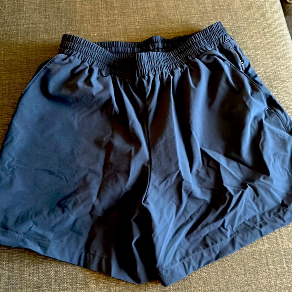 Men’s outdoor voices shorts. Lines, size small navy blue. NWOT